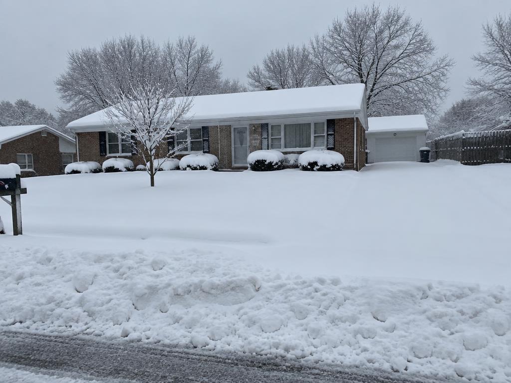 Snow-covered driveway before snow removal